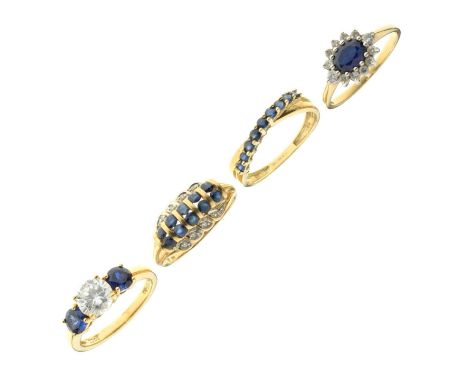 Four gem-set rings, each set sapphire-coloured blue stones and white stones, comprising a 14ct gold ring, two 9ct gold rings,