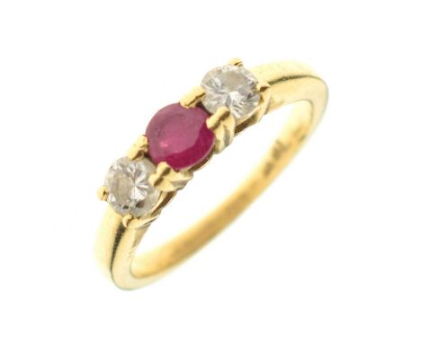 Ruby and diamond three-stone ring, the two round brilliant cut diamonds approximately 0.15ct each, the shank stamped '18ct', 