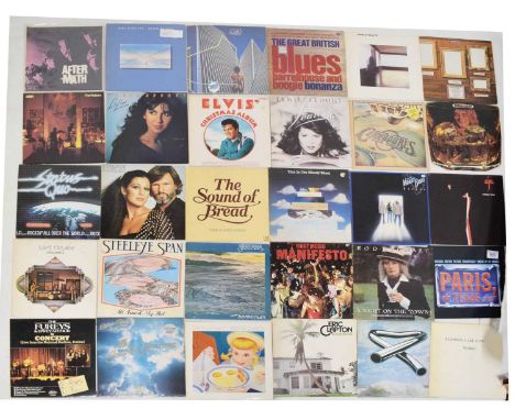 Quantity of late 20th century vinyl albums to include Rolling Stones, Dire Straits, Roxy Music, Emerson Lake &amp; Palmer, Mo