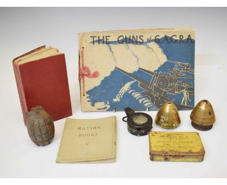 Assorted Word War I memorabilia including two nose cones, 1943 MKIII marching compass, The Guns of 6.A.G.R.A., empty grenade 
