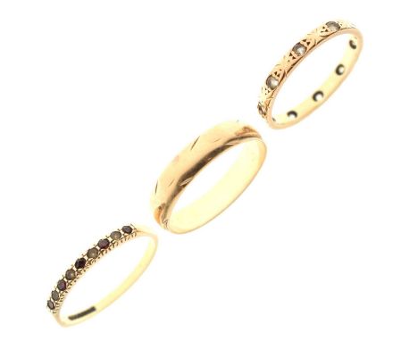 9ct gold wedding band, size P approx; a paste set wedding band, stamped '9ct', size M½ approx, and another ring set small red