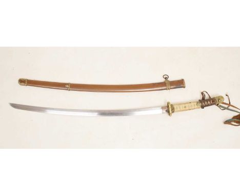 Japanese katana sword, 69cm long curved single edge blade, the hilt covered in fish skin and partial binding, brass engraved 