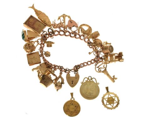 9ct gold charm bracelet attached various charms, including a Victorian gilded shilling, etc, 81g gross approx (some base meta