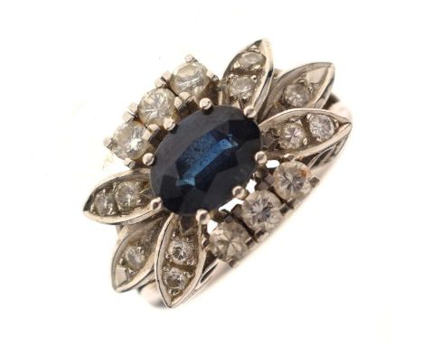 Sapphire and diamond cocktail ring, the oval sapphire 6.5mm x 8.5mm x 4mm deep approx, unmarked white metal, size R approx, 6