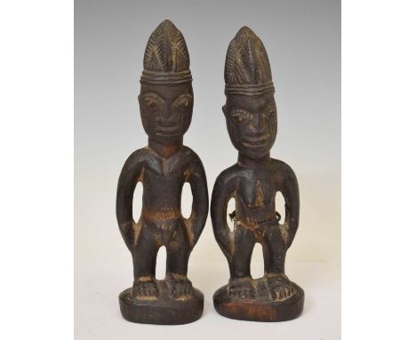 Ethnographica - Pair of Nigerian Ibeji softwood carved figures of a male and female, 27cm high (2)