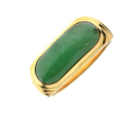 Jade 18ct yellow gold ring, the elongated oval cabochon rubover set, stamped '18K 750', size P approx, 8g gross approx