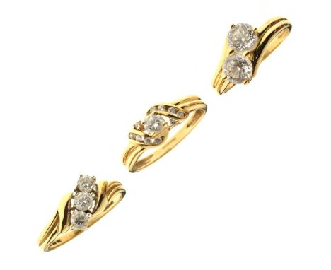 Three cubic zirconia set 14ct gold dress rings, 9.4g gross approx (3)