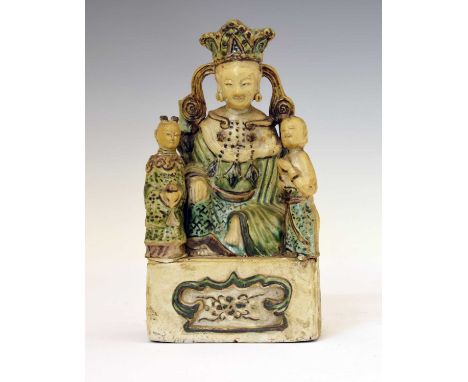 Chinese Famille Verte biscuit porcelain Guanyin figure group, modelled as a seated crowned Guanyin, goddess of Mercy, flanked