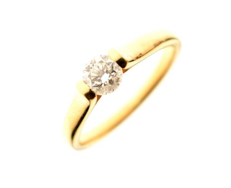 Diamond solitaire 18ct gold ring, the round brilliant cut tension set and measuring approximately 5mm diameter (0.45ct estima