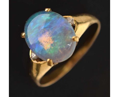 Water opal and diamond 18ct yellow gold ring, the oval opal cabochon 9.5mm x 12mm approx, with two small diamonds, the shank 