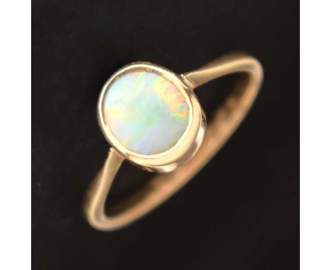 Opal cabochon ring, the yellow metal shank stamped '9ct', size O approx, 2g gross approx