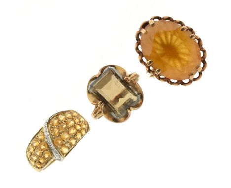 Three 9ct gold gem-set rings, including a 1970s smoky quartz ring, and a large 1970s citrine-coloured stone ring, 15.1g gross
