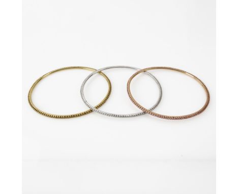 Three Diamond and 18 Karat Gold Bangle Bracelets Including: Approx. 1.90 Carat Fancy Intense Yellow Diamond and 18K Yellow Go