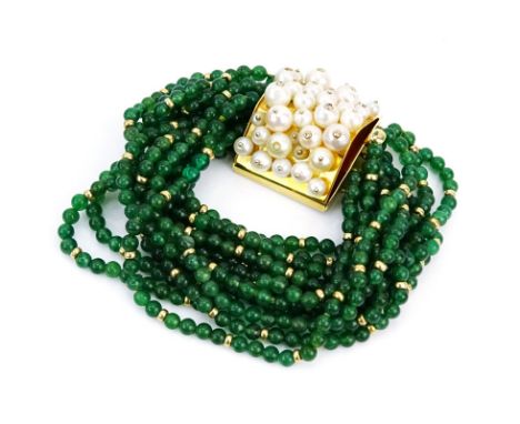 Circa 1950s Twelve (12) Strand Emerald Bead, Pearl and 18 Karat Yellow Gold Bangle Bracelet. Emeralds with vivid green color.