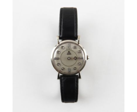 Circa 1950s Man's Gruen Mystery Dial 14 Karat White Gold Watch. Decorated with approx. 0.23 cts round cut diamonds hands/hour