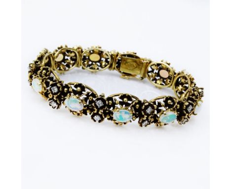 Circa 1970s Victorian style Cabochon Opal, approx. 1.0 Carat Round Brilliant Cut Diamond and 14 Karat Yellow Gold Bracelet. O