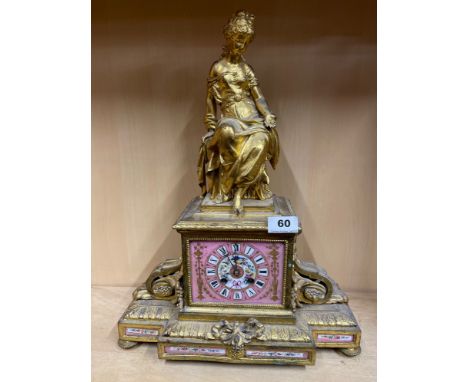 A 19th C French gilt metal mantel clock with porcelain dial and detail, H. 49cm.