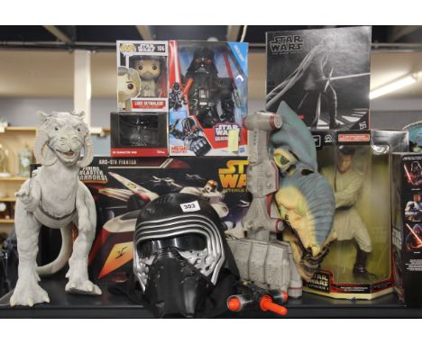 Cinematic interest: A collection of Star Wars memorabilia including, a boxed figure of Obi-Wan Kenobi, ARC-170 fighter, Luke 