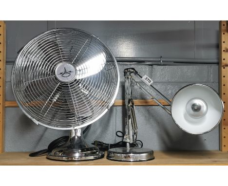 A chromium plated angle poise desk lamp and fan.