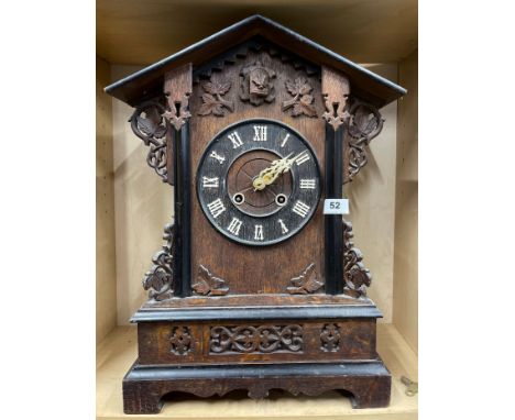 A 19th C carved oak black forest mantel cuckoo clock, H. 51cm.