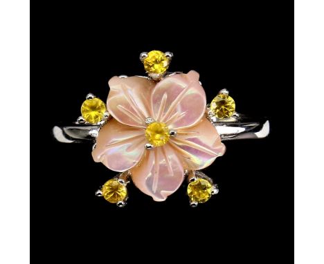A 925 silver ring set with carved mother of pearl and fancy yellow sapphires, (O.5).