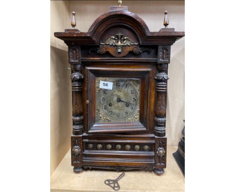 A Victorian silver-gilt dial wooden mantel clock with striking movement, H. 53cm.