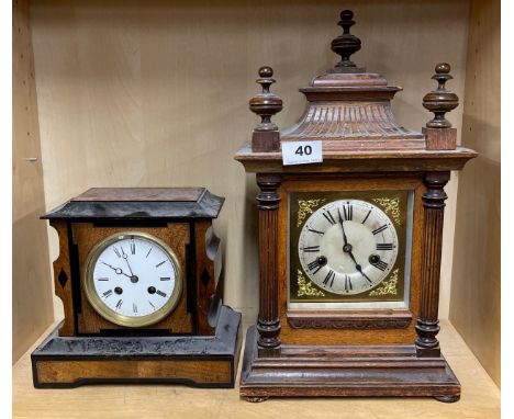 An oak striking mantel clock together with an ebony and burr wood mantel clock, largest H. 41cm.