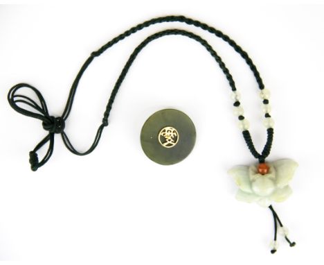 An interesting Chinese spinach jade disk mounted with a cultured pearl on one side and yellow metal character on the other, D