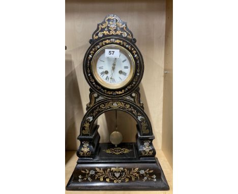 A 19th C brass and mother of pearl inlaid lacquered striking mantel clock, H. 49cm.