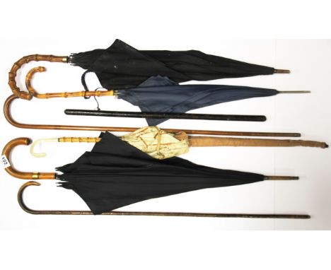 A partridge cane walking stick, a silver mounted walking stick, leather covered swagger stick and four vintage umbrellas.