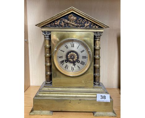 A 19th C gilt brass classical mantel clock by Maple &amp; Co Paris with striking movement, H. 31cm.