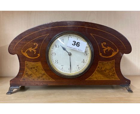 An Edwardian inlaid mahogany mantel clock, H. 15cm. Appears to be in working order.
