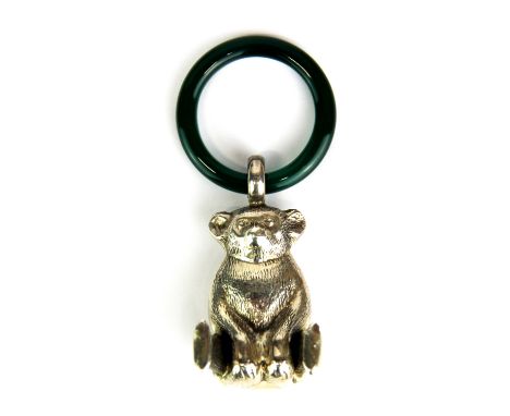 A sterling silver teddy bear teething ring with green cornelian ring, overall H. 8cm.