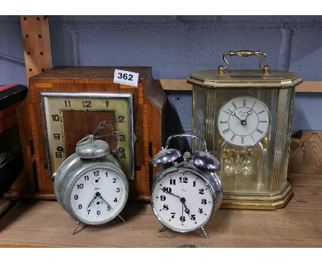 An Art Deco mantel clock and three others.