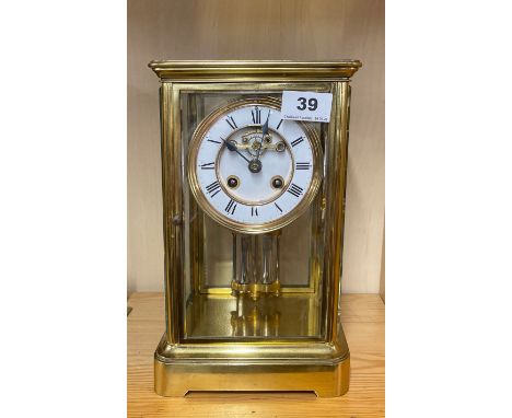 A gilt brass four glass mantel clock with mercury pendulum and striking movement, H. 27cm. Appears to be in working order.