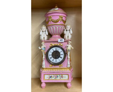 A 19th C French porcelain cased mantel clock, H. 59cm. One rear foot missing.