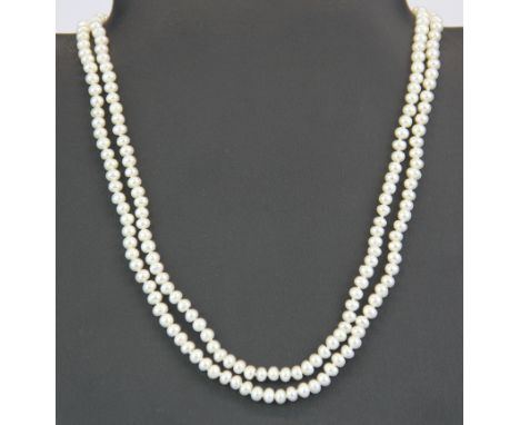 A two strand cultured pearl necklace on a vintage silver and marcasite clasp.