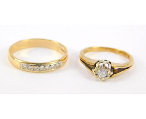 A 9ct gold and diamond solitaire ring, high claw set, on a split shank, approximately 1/16 carat, size J, together with a 9ct