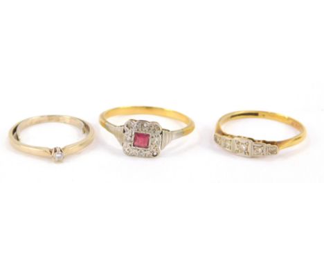 A gold and diamond five stone ring, illusion set, size Q, gold and diamond solitaire ring, size K, and an Art Deco ruby and d