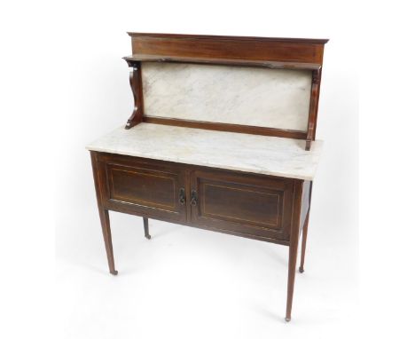 A Victorian mahogany and white marble topped washstand, the white marble splash back beneath a shaped shelf with boxwood line