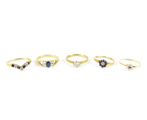 9ct gold and gem set rings, including a zircon solitaire ring and a wishbone ring, sizes N/R, 7.1g.