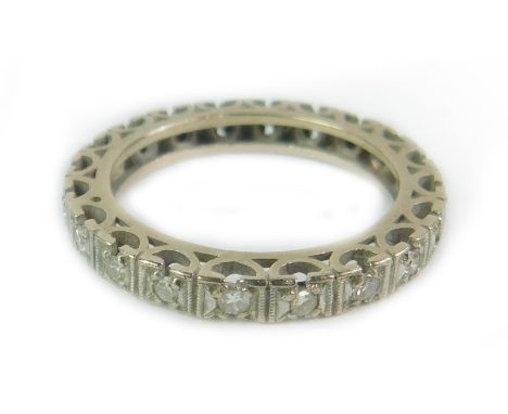 A diamond full eternity ring, set in white metal, size N, 4.0g. (A/F)