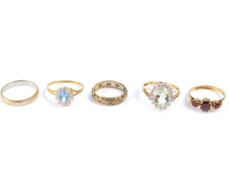 Three 9ct gold and gem set rings, full eternity ring, and a white gold wedding band, sizes I-Q, 10.6g.