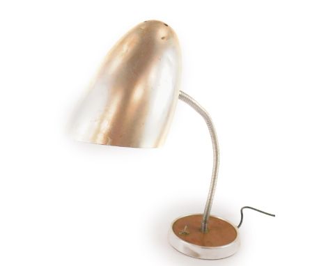 A mid 20thC industrial steel anglepoise lamp, raised on a circular metal and wooden base, 63cm H extended.