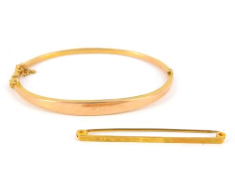 A 9ct rose gold bangle, on a snap clasp with safety chain as fitted, together with a 9ct gold pin, 5.4g.