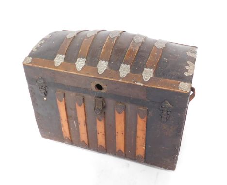 A tin and pine domed trunk, with metal appliques and twin leather carrying handles, 68cm H, 87cm W, 48cm D.