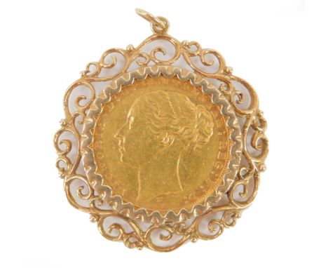 A Victorian full gold young head sovereign 1879, in a 9ct gold scrolling pendant mount, 11.4g.
