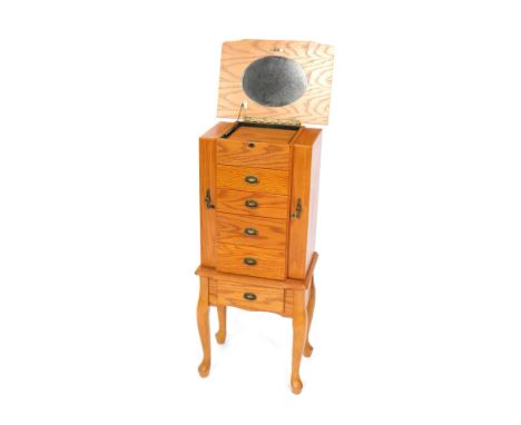 An oak vanity chest, with musical movement playing Swan Lake after Tchaikovsky, the lift up lid opening to reveal a box over 