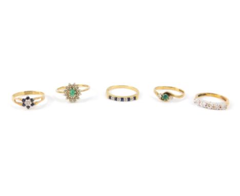 9ct gold and gem set rings, including a crossover ring, five stone ring, and a sapphire and diamond flower head ring, sizes J