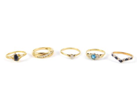 9ct gold and gem set rings, including a crossover ring, wishbone ring and a solitaire ring, sizes M/P, 7.1g.